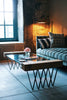 a couch and a coffee table in a room with a fireplace
