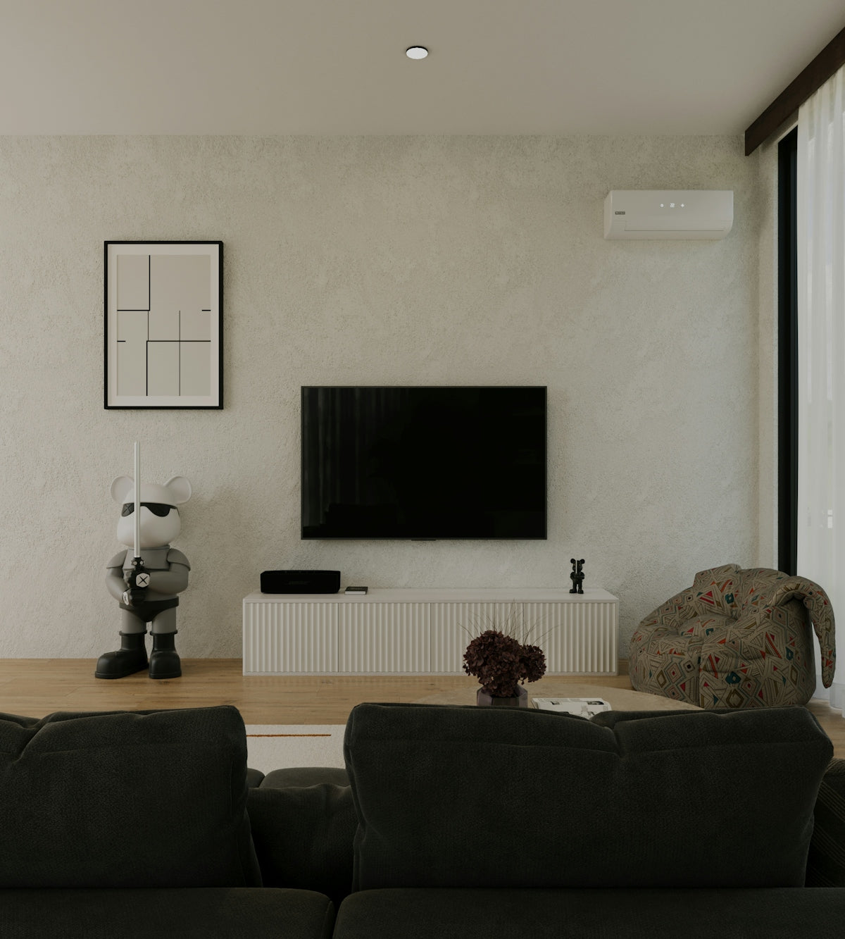 a living room with two couches and a flat screen tv