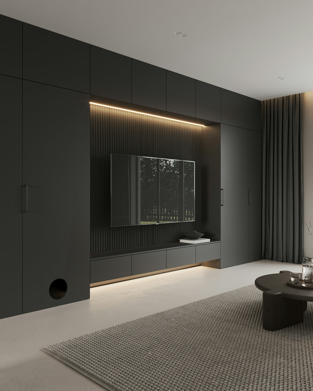 A living room with a couch, coffee table and television