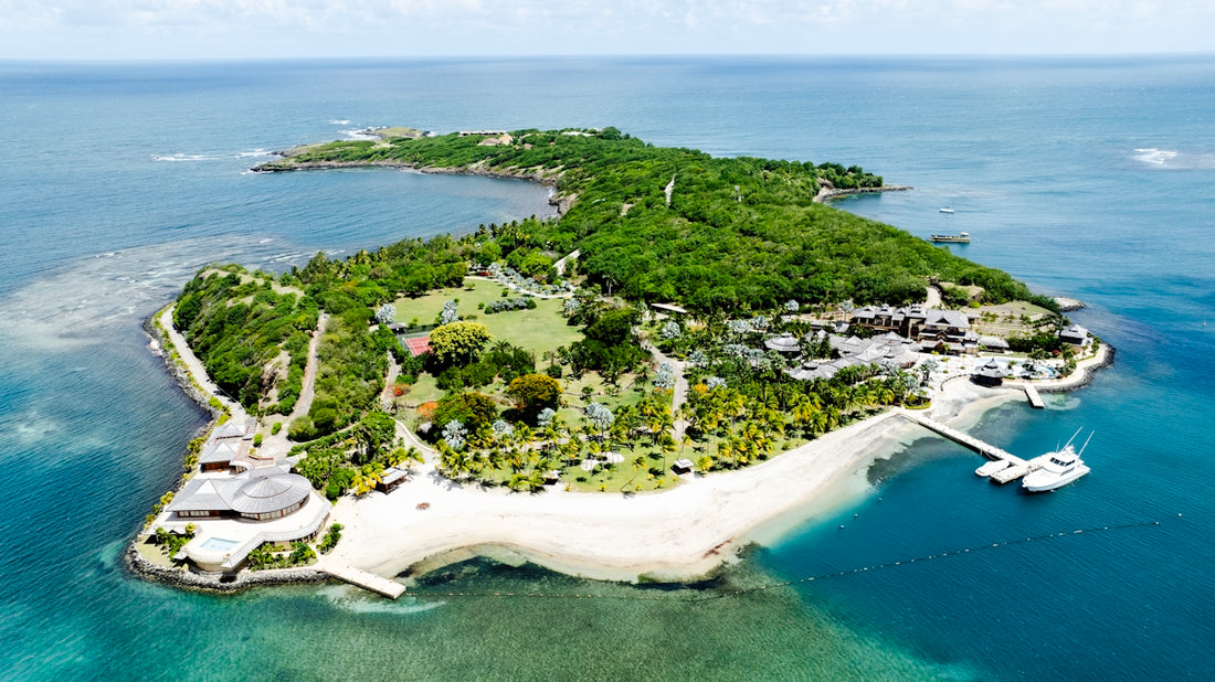 A lush, green island surrounded by turquoise water.