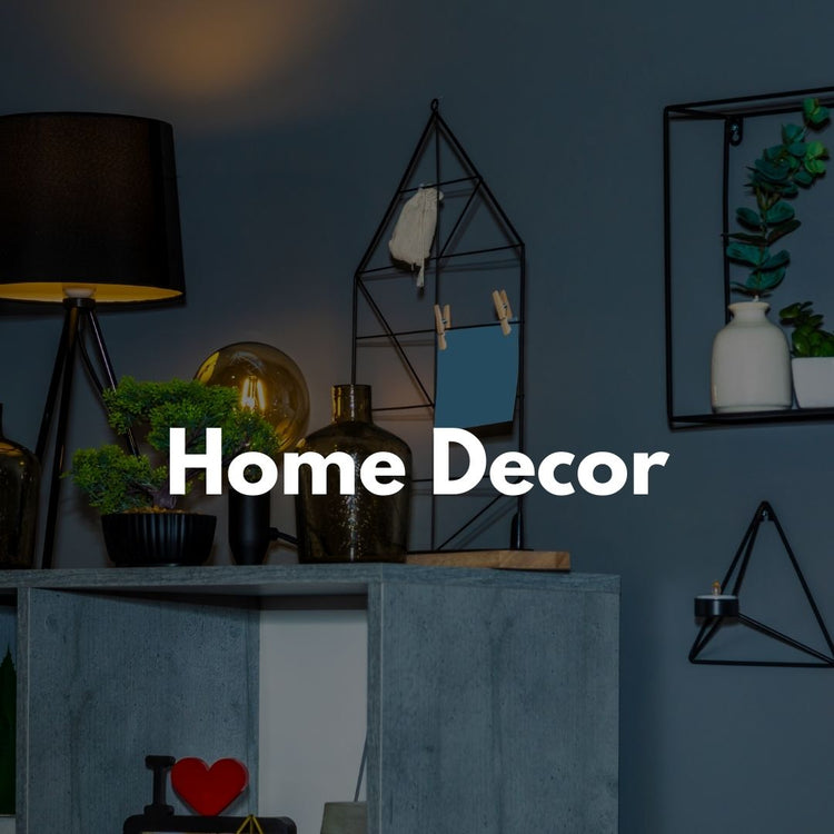 Home decor items including wall art, vases, and candles for stylish interiors.