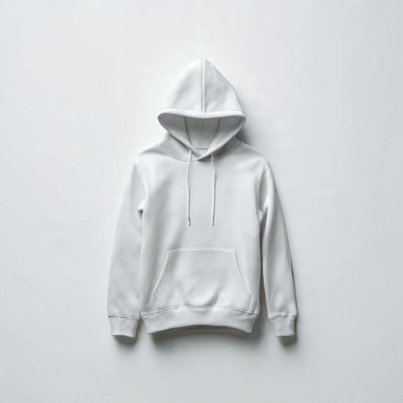 “A folded women’s hoodie centered on a pure white seamless background. Straight-on studio photography with soft lighting and a subtle shadow. No text, no logo, no model, no props.”