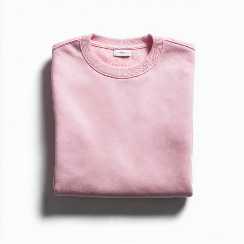 “A folded women’s T-shirt centered on a pure white seamless background. Straight-on high-end product photography with soft lighting and minimal shadow. No text, no logo, no model, no props.”