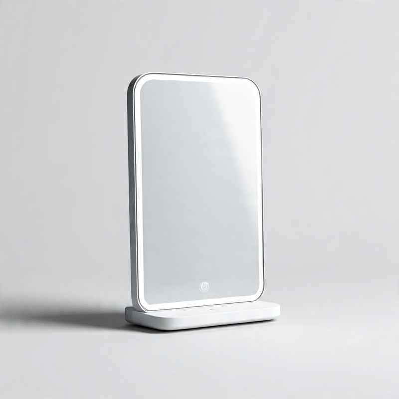 “A modern smart mirror or smart vanity device centered on a pure white seamless background. Straight-on premium tech product lighting with a soft shadow. No text, no logo, no model, no props.”