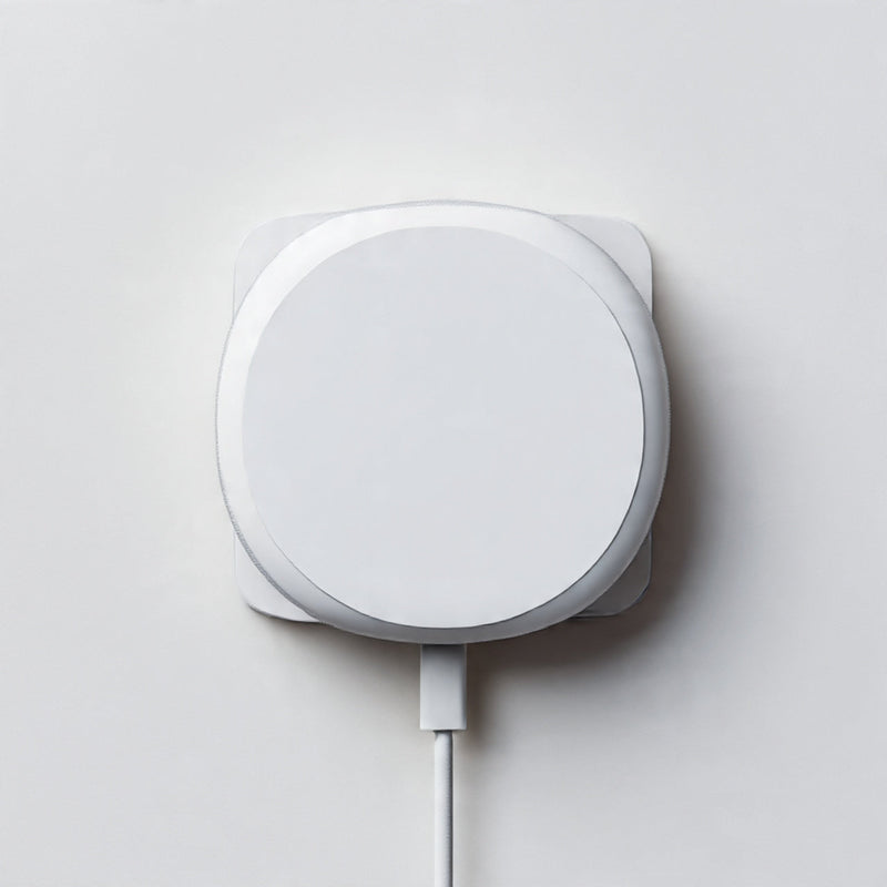 “A modern MagSafe charger or accessory centered on a pure white seamless background. Straight-on premium tech product shot with soft lighting and a clean shadow. No text, no logo, no model, no props.”