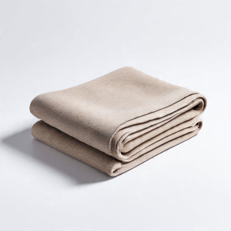 “A neatly folded premium blanket or throw placed on a pure white seamless background. Straight-on product photography with soft lighting and minimal shadow. No text, no logo, no model, no props.”