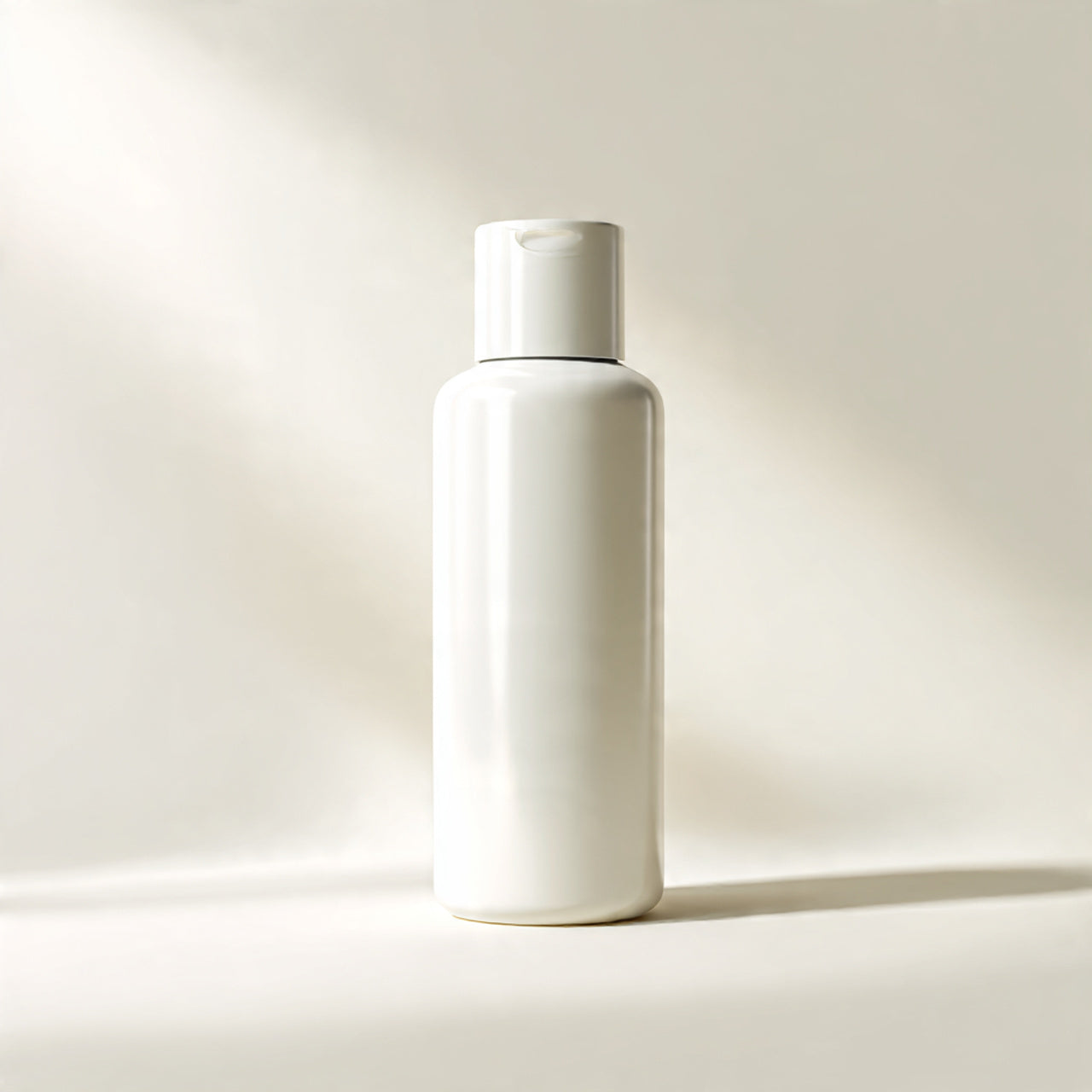 “A premium skincare bottle or jar centered on a pure white seamless background. Straight-on studio shot with soft lighting and a clean shadow. No text, no logo, no model, no props.”