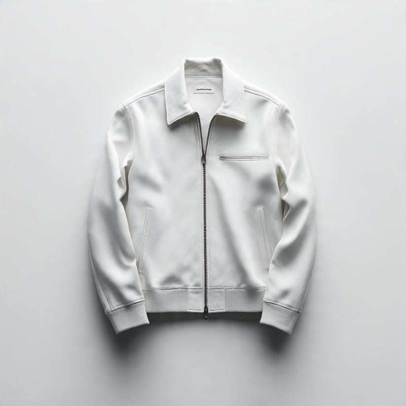 “A single men’s jacket centered on a pure white seamless background. Straight-on high-end product shot with clean studio lighting and a soft shadow under the jacket. Minimal, luxury presentation. No text, no logo, no model, no props.”