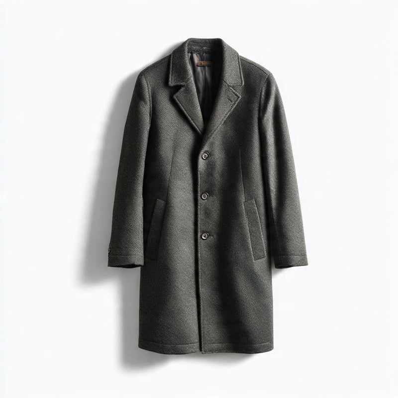 “A single men’s overcoat or long coat displayed on a pure white seamless background. Straight-on premium studio shot with soft lighting and a subtle natural shadow. High-quality product photography. No text, no logo, no model, no props.”