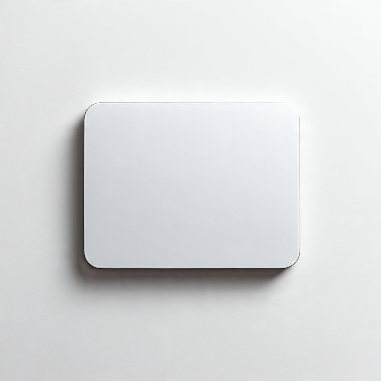 “A single minimalist desk accessory (mousepad, organizer, or keyboard) centered on a pure white seamless background. Straight-on product shot with soft lighting and a subtle shadow. No text, no logo, no model, no props.”