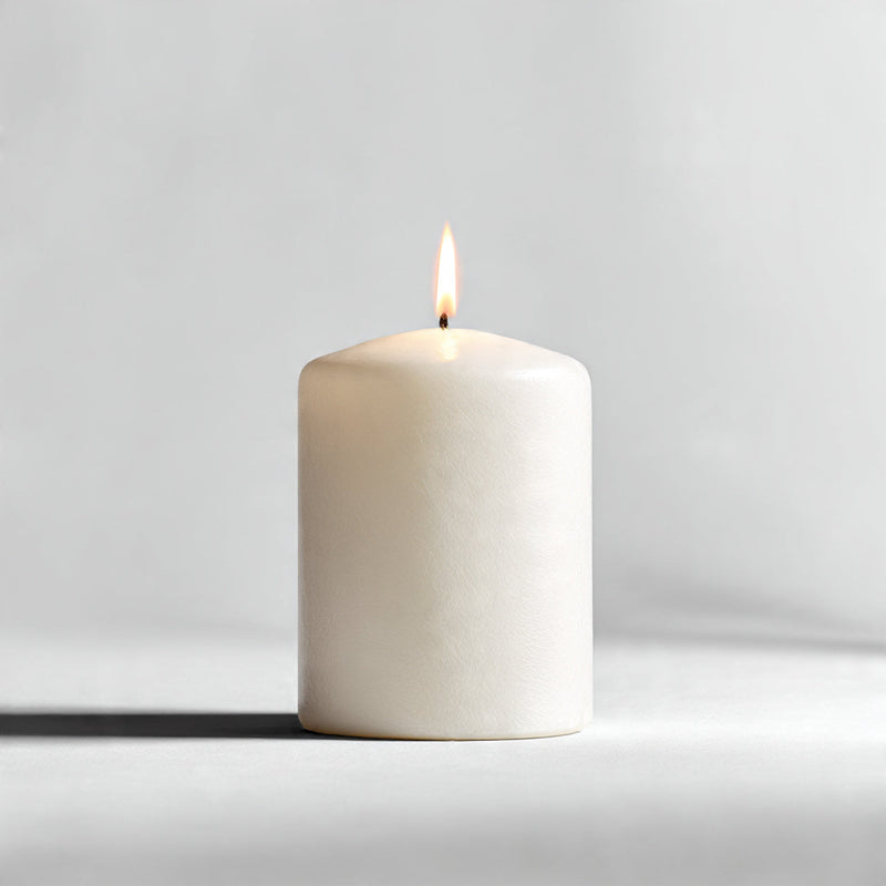 “A single premium candle centered on a pure white seamless background. Straight-on studio shot with soft lighting and a clean shadow. No text, no logo, no model, no props.”