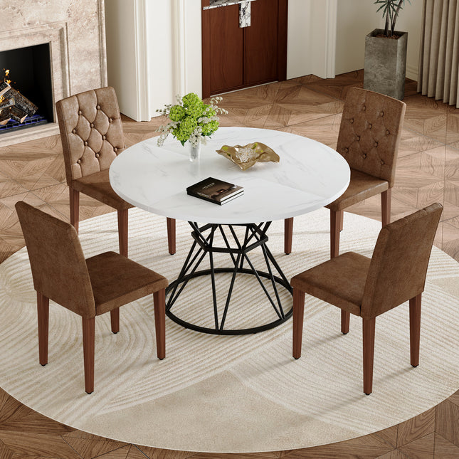 Table and chair set. A white MDF table with a diameter of 47.3 inches,black hourglass shaped metal brackets.Paired with 4 Brown Suede Fabric Chairs:Features a decorative button-tufted backrest.
