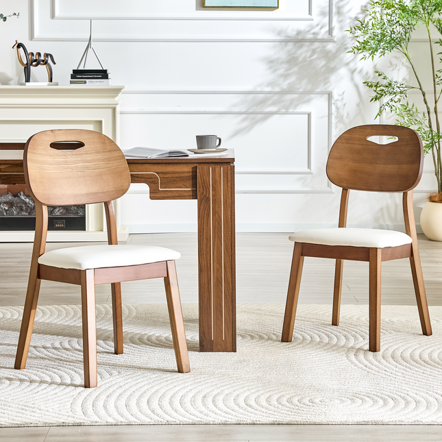 2 walnut colored solid wood dining chairs, white PU soft seat cushions, hollowed out backrests, and home dining chairs.