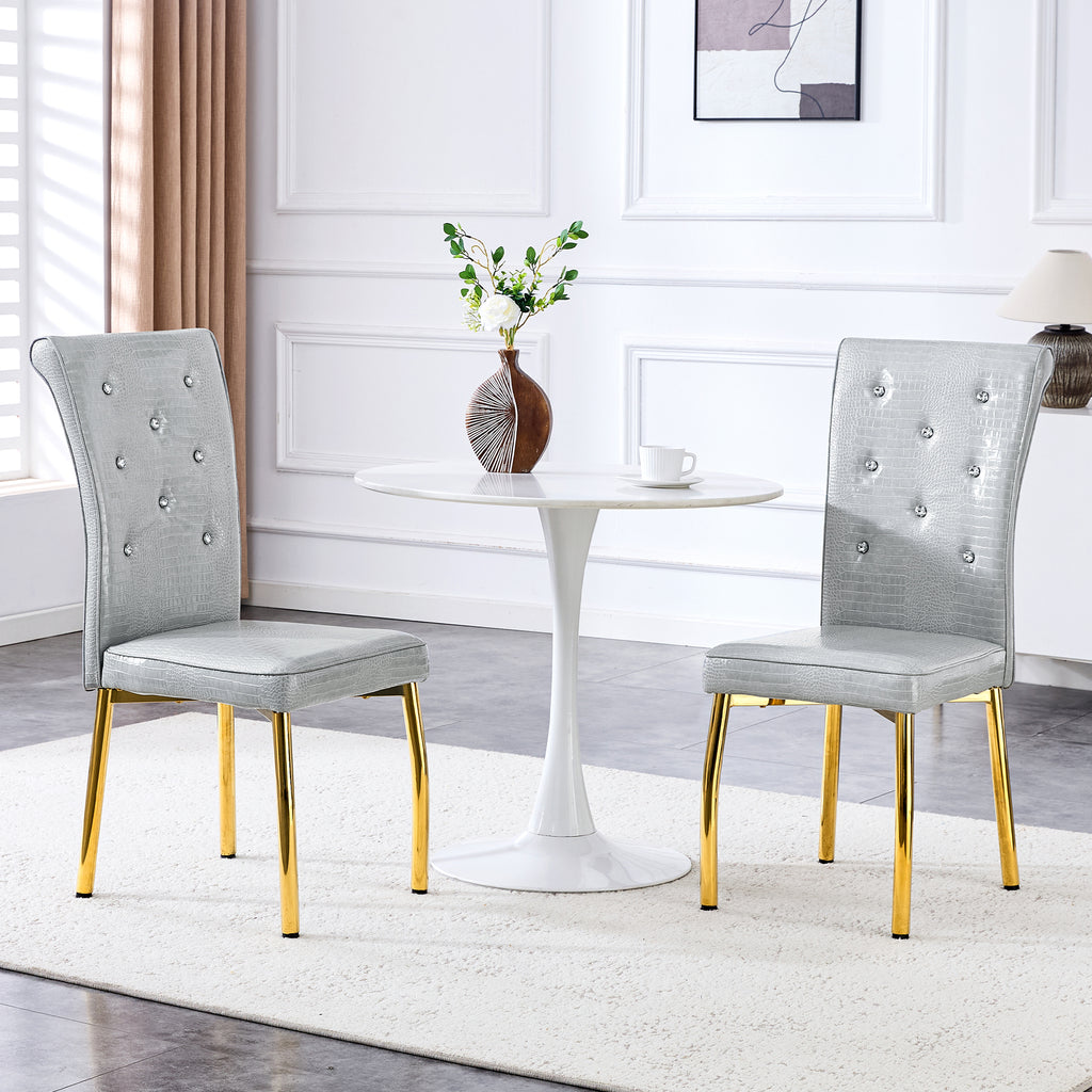 A set of 2 gray and gold vintage crocodile leather cushioned dining chairs, featuring crystal clasp design and artificial leather design, adding a touch of elegance and mystery to the dining area