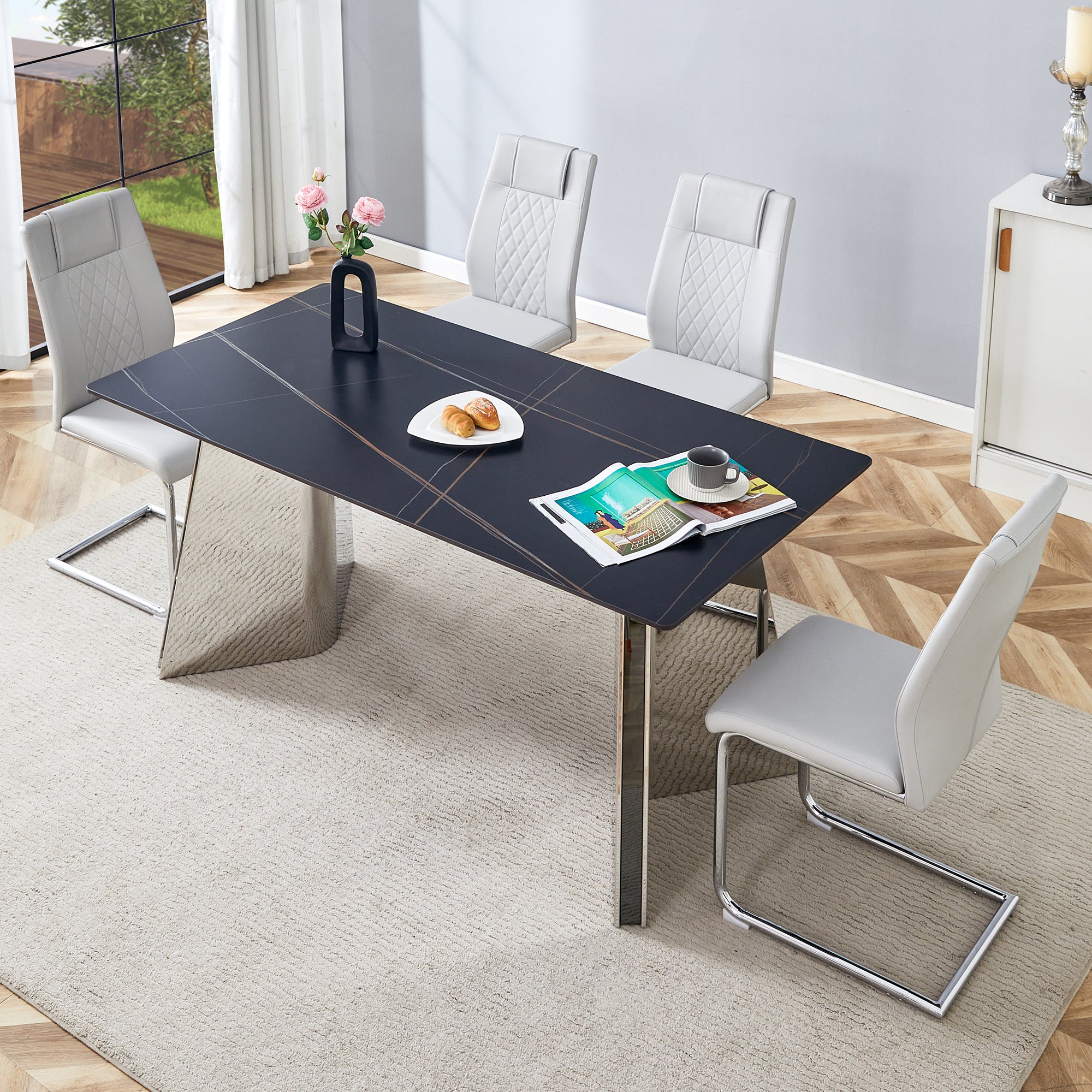 Table and chair set.63'x31.5x30' Black Marble-Patterned Slabs Tabletop with Stainless Steel Butterfly Legs.Paried with 4 Light gray high-quality PU chairs with silver metal legs.