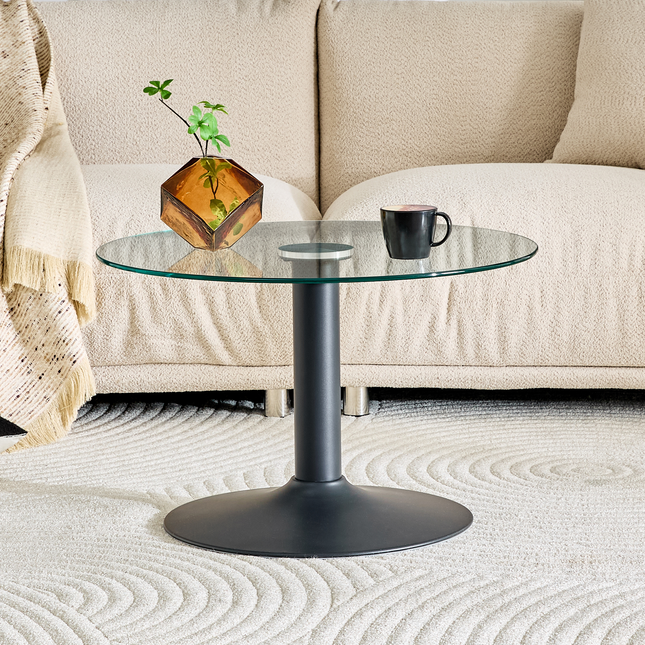 27.5-inch diameter round tempered glass coffee table. 17.7 inches high, supported by a black metal base, with a light luxury edge.