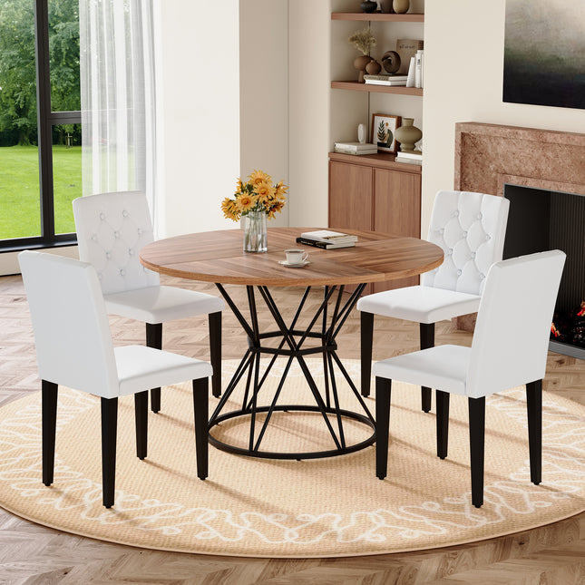 Table and chair set. A circular walnut MDF dining table with a diameter of 47.3 inches,black hourglass shaped metal brackets.Paired with 4 white PU dining chairs: ergonomic buckle backrest.