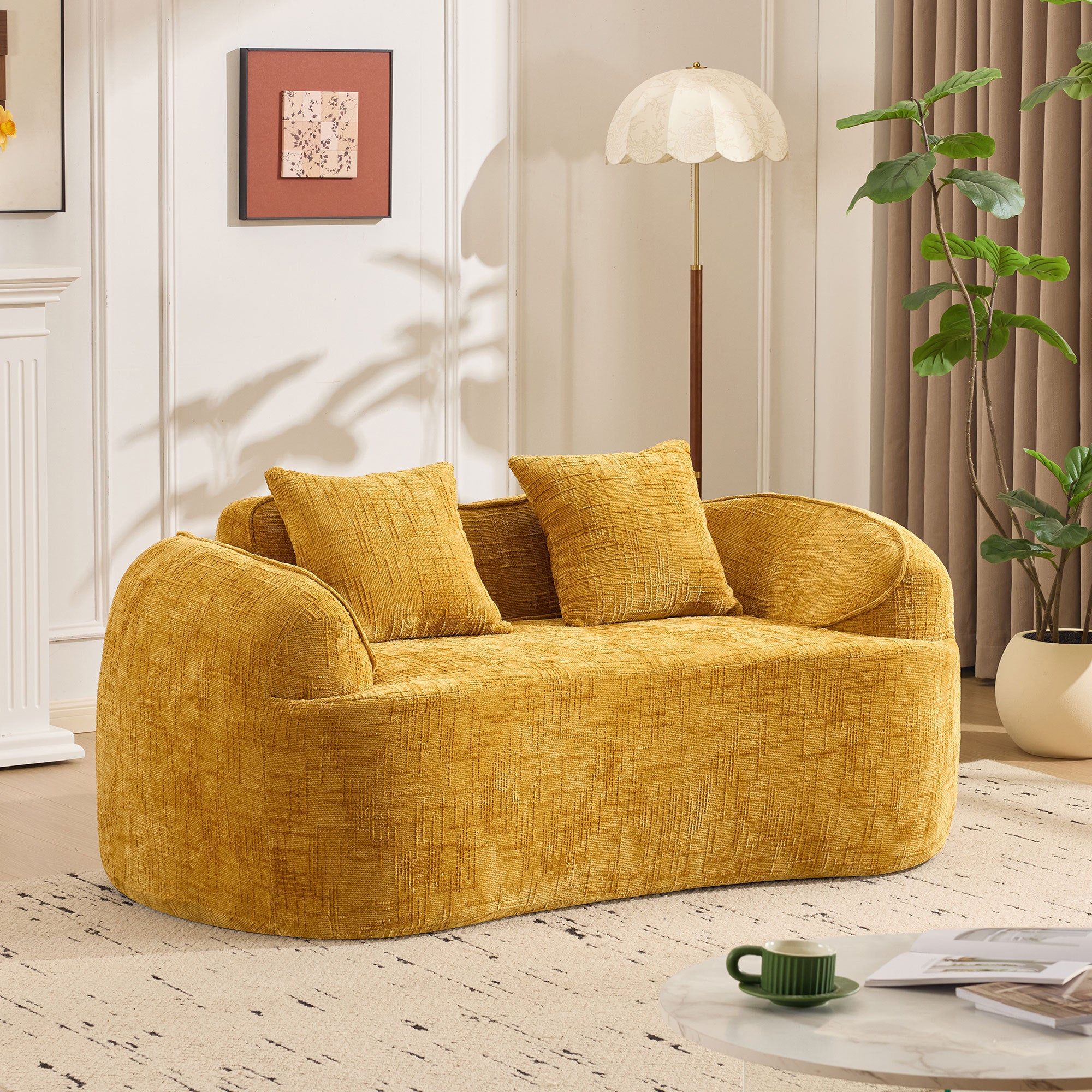 Yellow curved two - person compress  sofa. It has armrests on both sides, comes with two pillows, is suitable for small - sized apartments, and can be placed in the living room or bedroom.