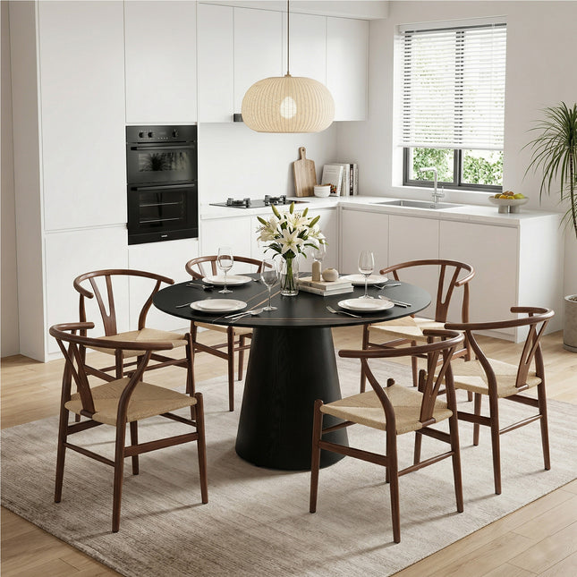 Table and chair set. A 42 inch rock slab round table, paired with six uniquely designed dining chairs with walnut coloer metal legs. The table legs are made of black density board material.