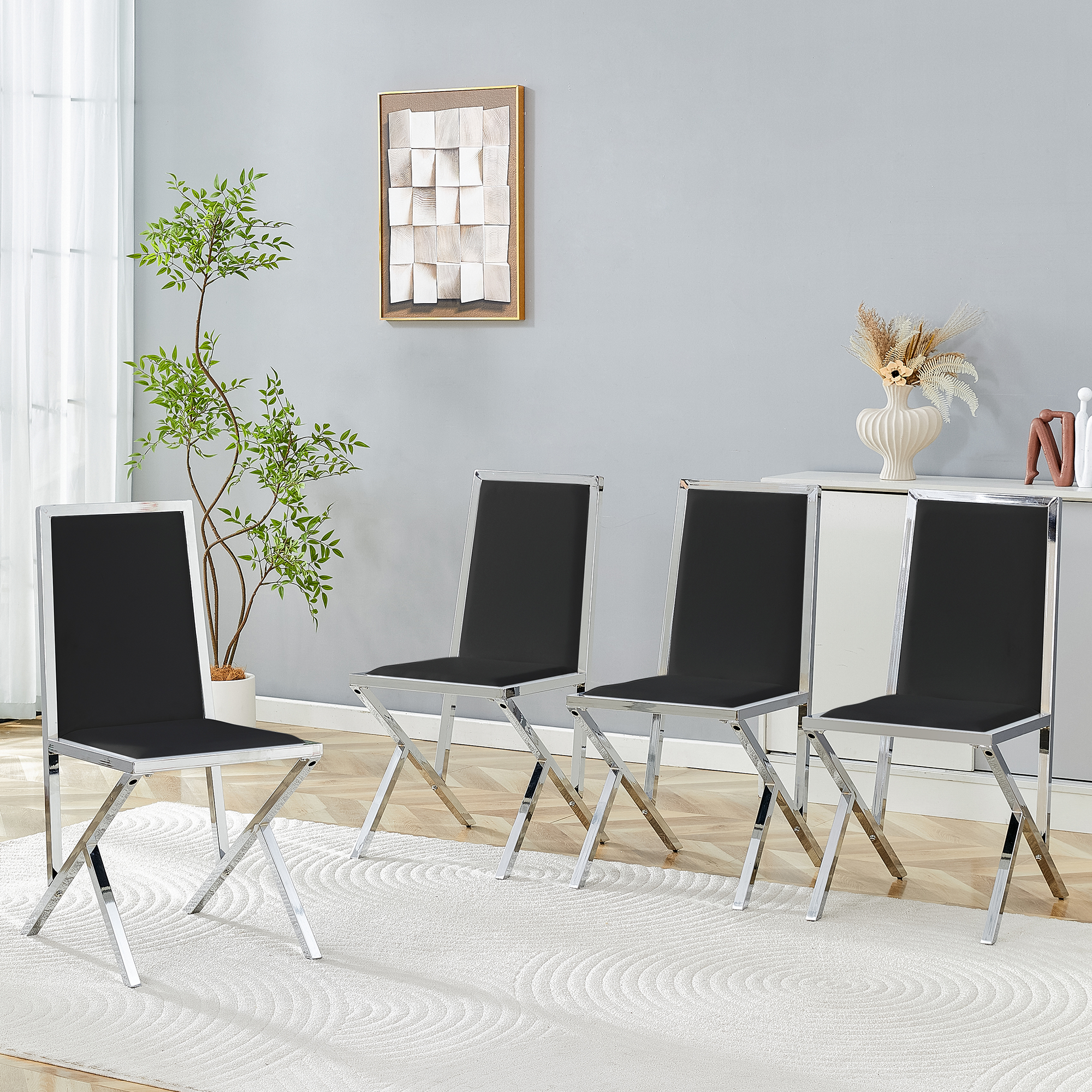 4-pack silver metal framed black PU dining chairs: ergonomic design, a simple and luxurious choice.Featuring uniquely designed silver metal legs.