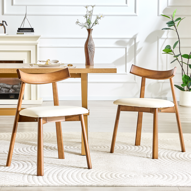 2 walnut colored solid wood dining chairs, with white PU soft cushions and curved backrests that fit the curves of the back, suitable for home dining.