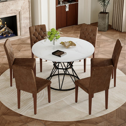 Table and chair set. A white MDF table with a diameter of 47.3 inches,black hourglass shaped metal brackets.Paired with 6 Brown Suede Fabric Chairs:Features a decorative button-tufted backrest.