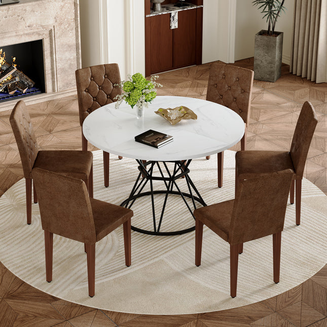 Table and chair set. A white MDF table with a diameter of 47.3 inches,black hourglass shaped metal brackets.Paired with 6 Brown Suede Fabric Chairs:Features a decorative button-tufted backrest.