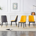 A modern dining chair with orange yellow dark gray dual tone PU leather backrest and black metal legs, suitable for kitchens, bedrooms, and offices. Set of 4 pieces.W1151118965