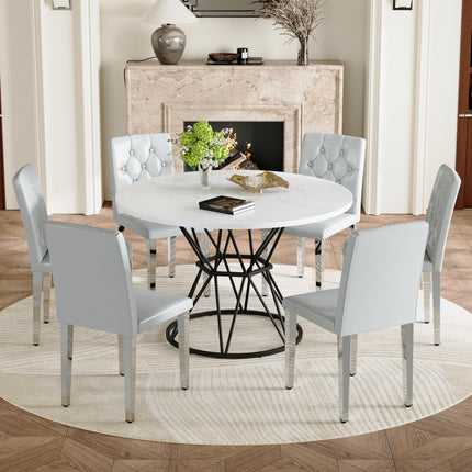 Table and chair set. A circular white MDF dining table with a diameter of 47.3 inches,black hourglass shaped metal brackets.Paired with 6 light gray PU dining chairs: ergonomic buckle backrest.