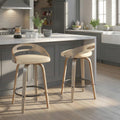 Cassis 26' Mid-Century Modern Fixed-Height Counter Stool with Swivel in Light Grey Wood and Cream Faux Leather with Round Black Metal Footrest by LumiSource - Set of 2