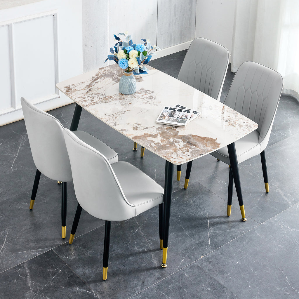 Table and chair set.48.4*28 Inch White Sintered Stone Dining Table Set - 4 Light Gray chairs with PU cushions and black metal legs.