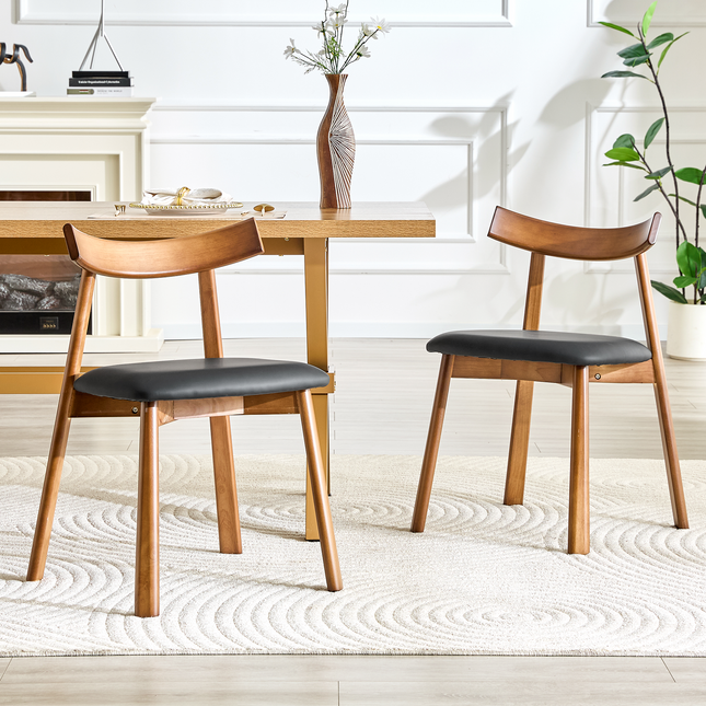 2 walnut colored solid wood dining chairs, with black PU soft cushions and curved backrests that fit the curves of the back, suitable for home dining.