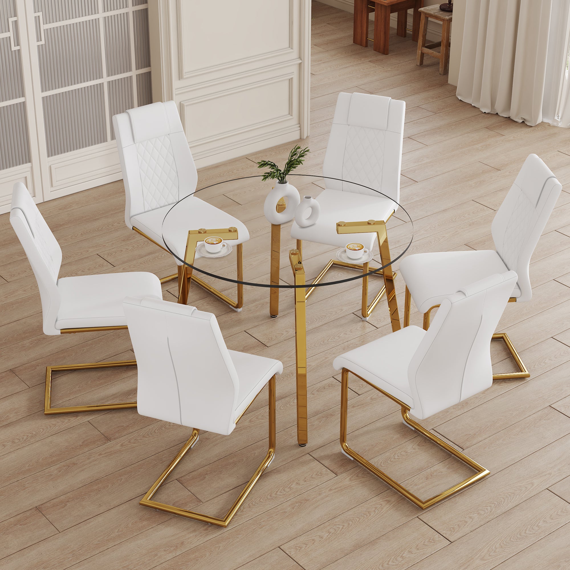 Table and chair set.A Modern Minimalist Style Round Clear Tempered Glass Table with Metal Legs.Paried with white chairs with Modern PU Leather High Back Upholstered and C-Tube Golden Legs.