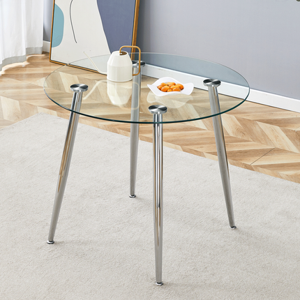 Round dining table with glass top, silver metal legs, exquisite life, starting from the details, the silver legs show an extraordinary texture, which is the finishing touch to your home