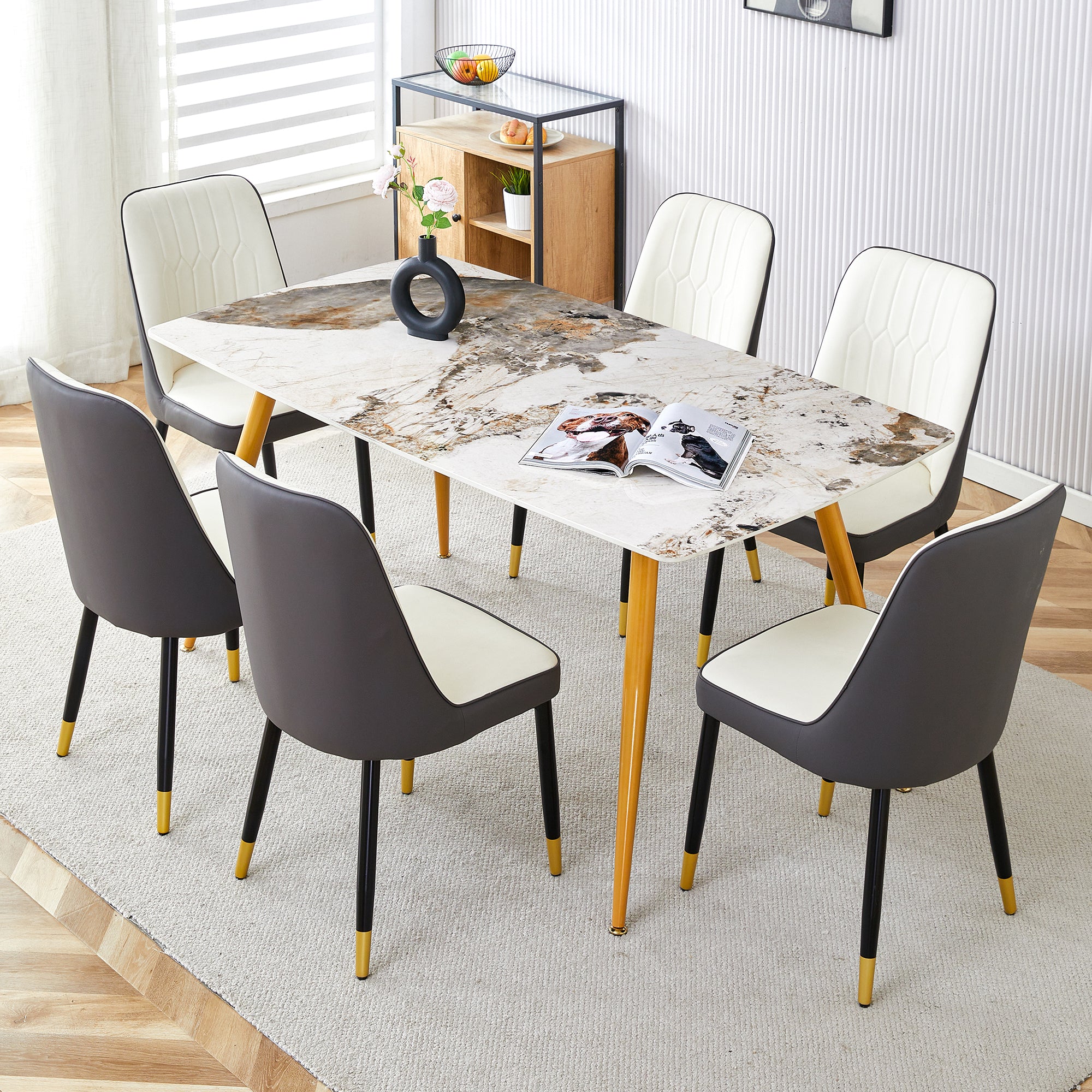 Table and chair set.Modern minimalist dining table. White imitation marble pattern SINTERED STONE desktop with golden metal legs.Paried with 6 comfortable chairs with PU seats and black metal legs.