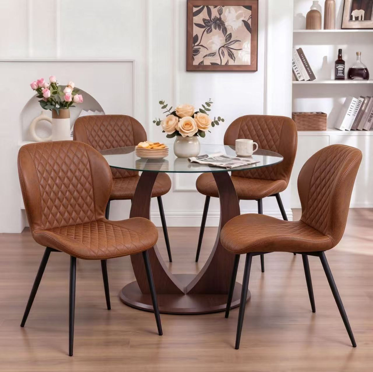 Table and chair set. A 38.6 inch glass round table, paired with four uniquely designed dining chairs with black metal legs. The table legs are made of walnut density board material.