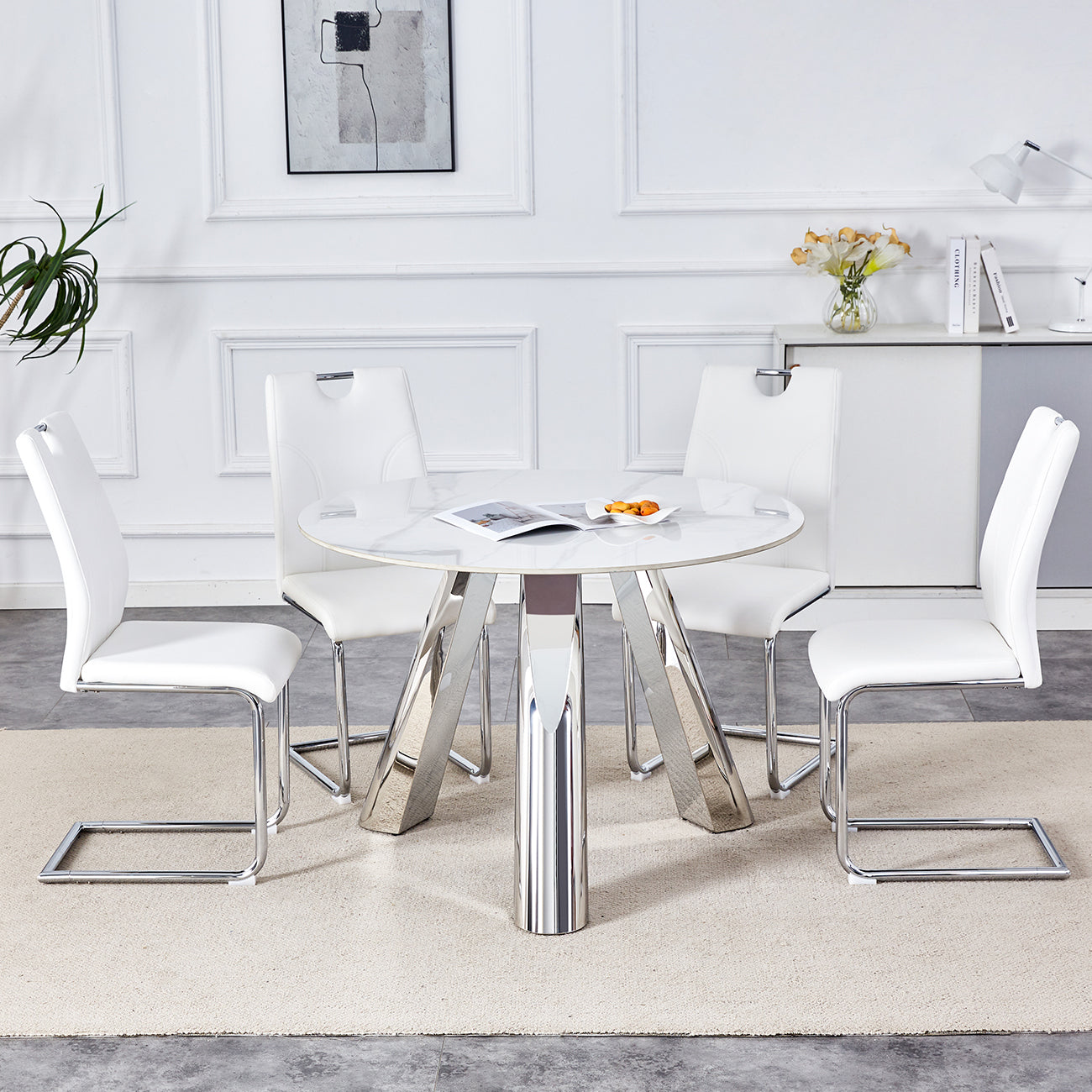 Table and chair set.A 42-inch stainless steel leg round table .Paired with 4 Uniquely designed White Dining Chairs With Silver Metal Leg.Sintered Stone Tabletop,Stainless Steels Table Legs.